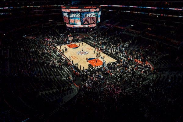 An indoor basketball arena showing a 